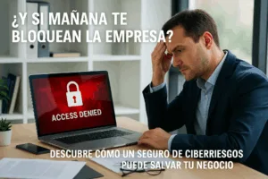 Empresario preocupado frente a un ordenador bloqueado con mensaje de acceso denegado, representando un ciberataque en una pyme.